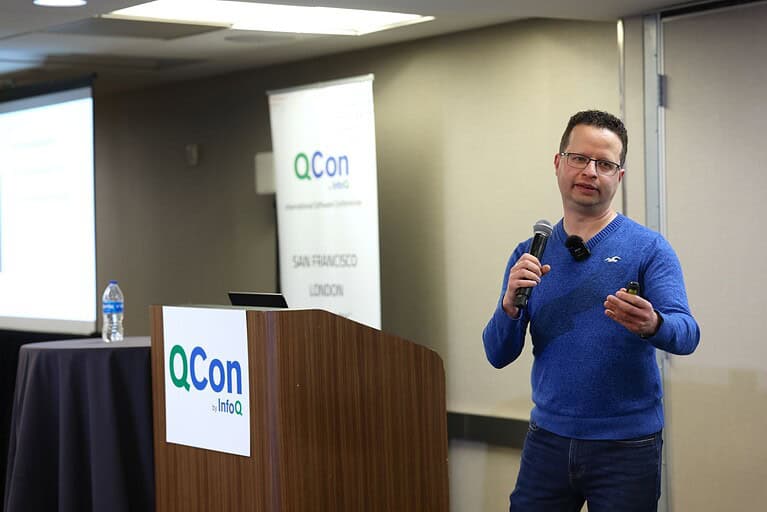 A picture of Eran Stiller presenting at QCon