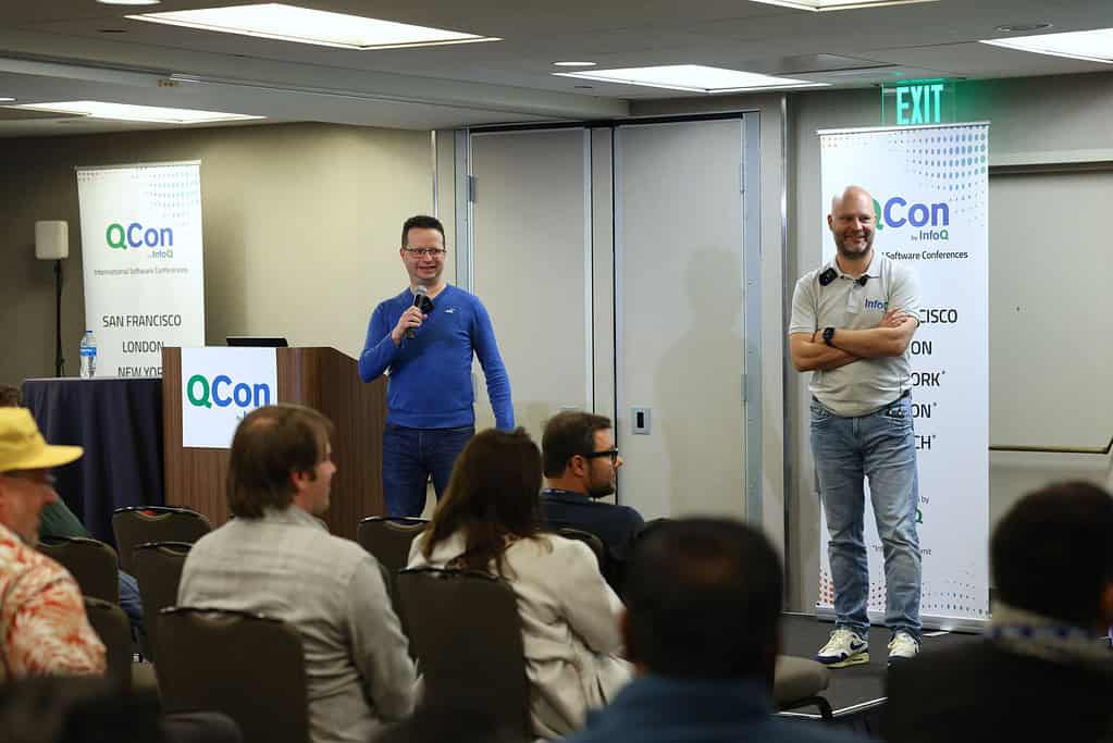 A picture of Eran Stiller and Steef-Jan Wiggers presenting at QCon