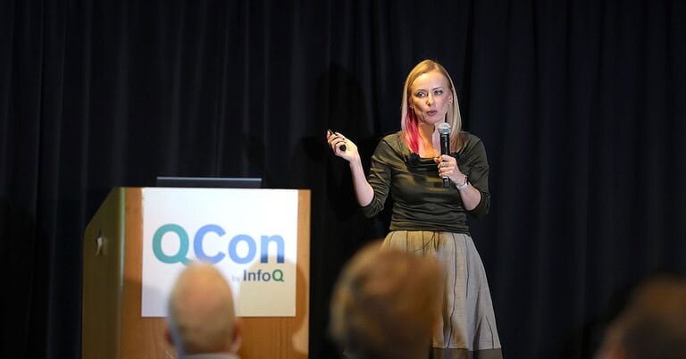 A picture of the presenter at QCon